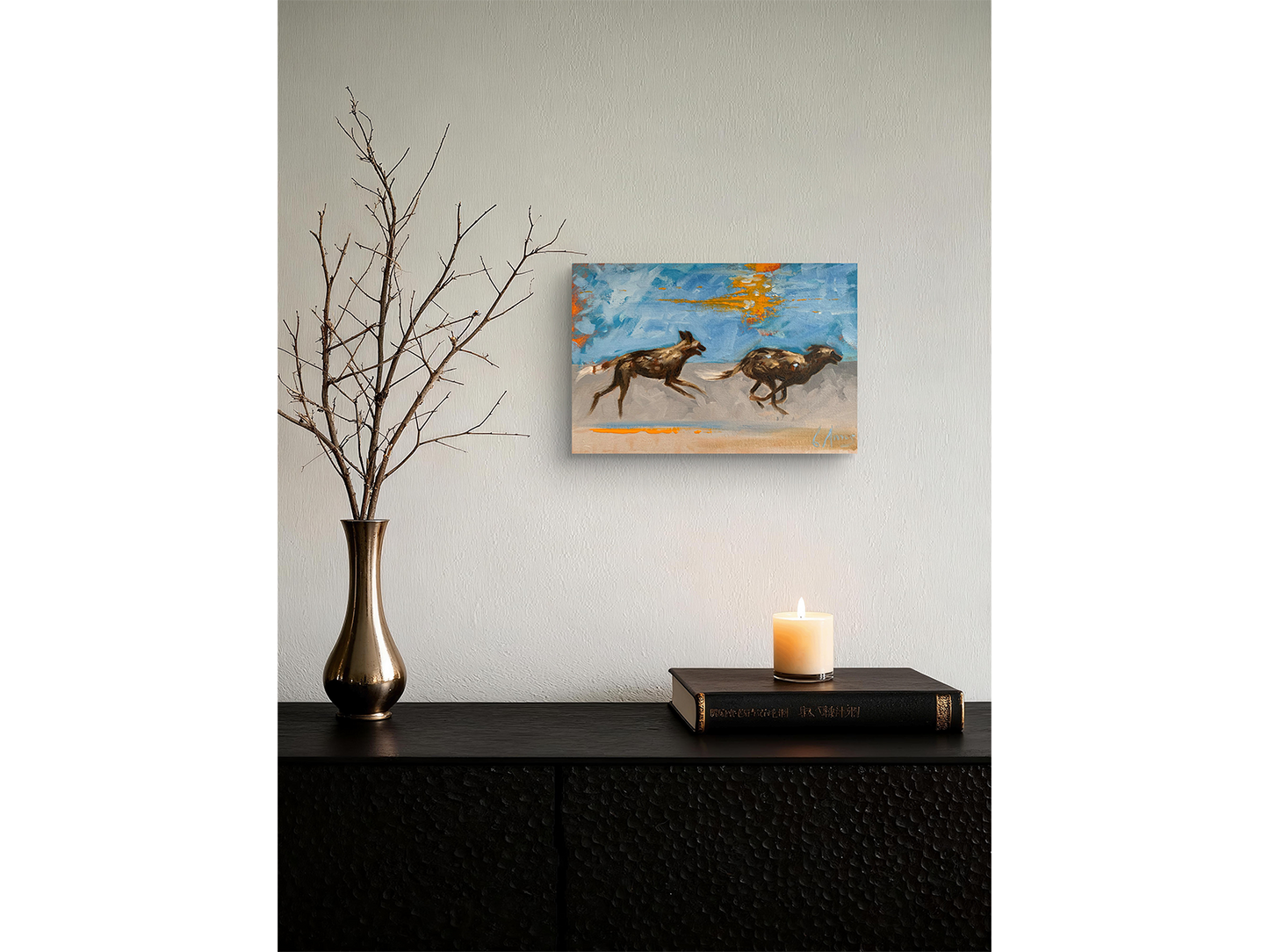 Expressive oil painting of two African wild dogs running mid-stride against a blue background with bright orange impasto accents by Charles Amos.