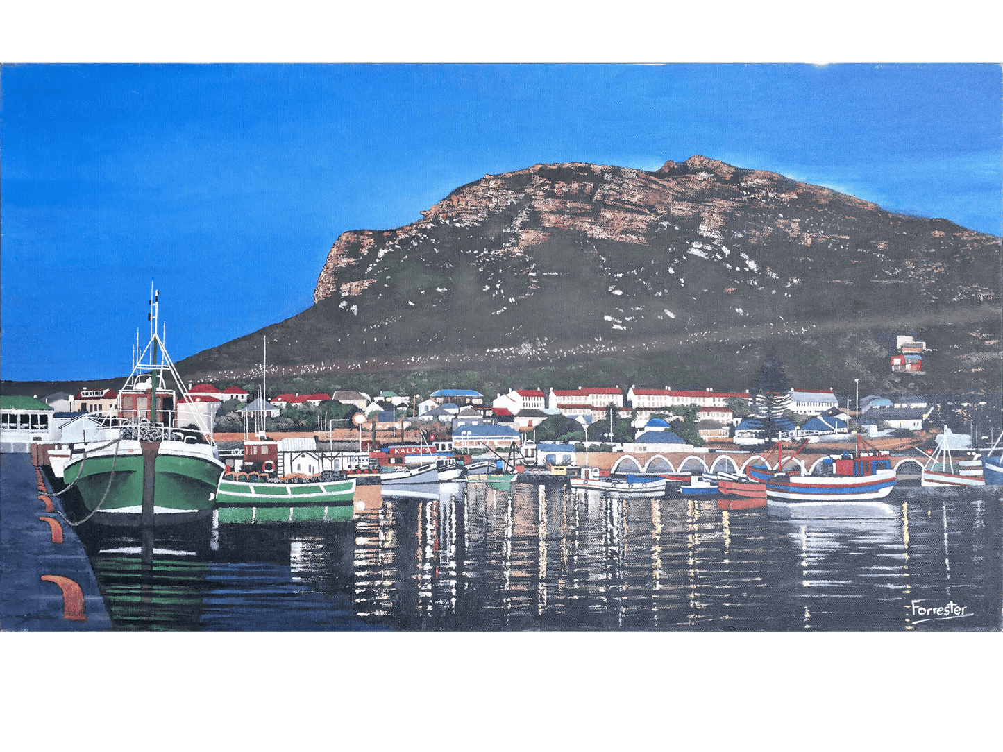 Oil on canvas, 48 cm (Height) x 87 cm (Width), showing Kalk Bay Harbour in the early evening. Colourful fishing boats and town buildings reflect in the dark water, backed by a large, steep mountain under a deep blue sky.